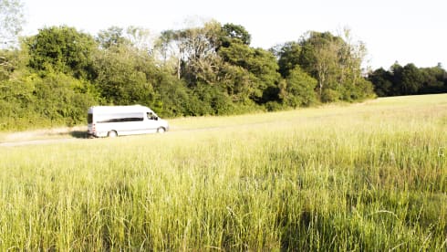 Orla – Off-grid, Heated, 3-Berth Mercedes Camper with Wood Interior & River Table