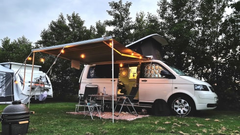 cool and cozy off grid camper van with lifting roof.