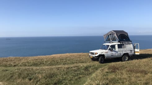Unique camping cruiser 4x4 with roof tent