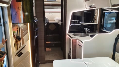 8 – luxury 4 person mclouis Carat 2022 with fixed bed in the back