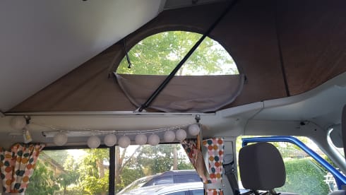 Cheerful Volkswagen camper van with lifting deck and pull-out bed for 2 people