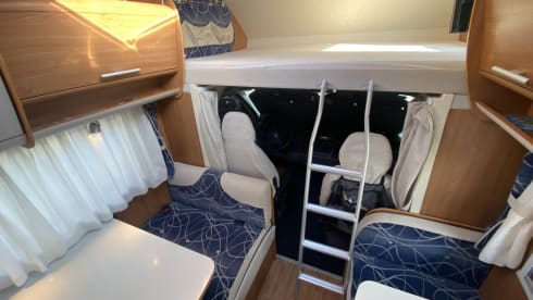 Cel4night – 7-seater overcab motorhome