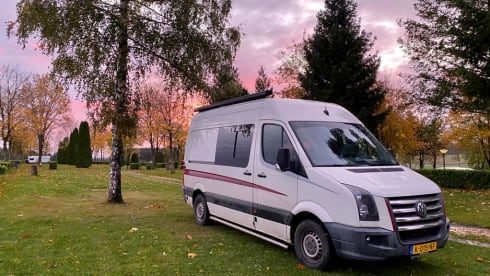 Home is where we park it! – Cool, fresh, self-sufficient 4 person bus camper.