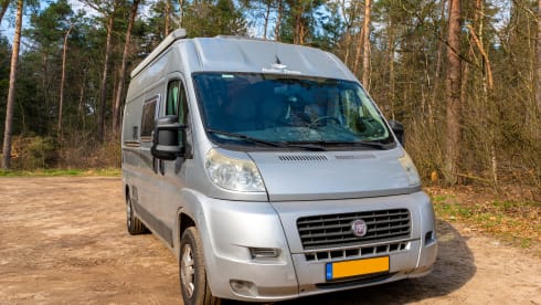 2 person bus camper with fixed bed and sanitary facilities