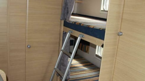 Spacious furnished family camper with bunk beds and air conditioning