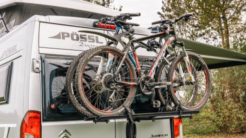 Fijnja – Luxury 4 pers. Pössl bus camper with sleeping lifting roof from 2019