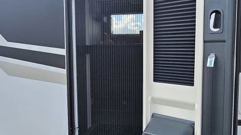 Luxury 4-person motorhome with bicycle rack and tow bar, model 2026
