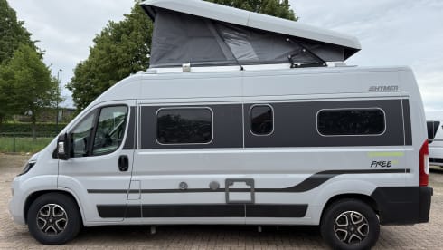 Making Memories 10 – Hymer Free 602 Automatik, Baujahr 2024, mit Aufstelldach und Fahrradträger für 4 Personen