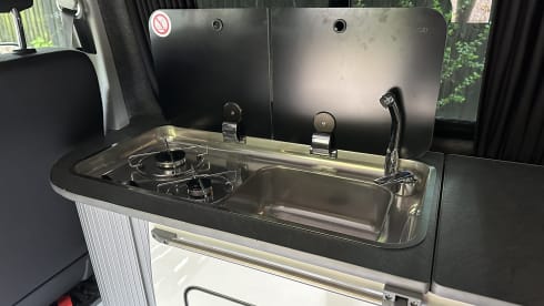 Biscy – 4 berth VW Campervan (Gas stove, 2 double beds, & gated car storage)
