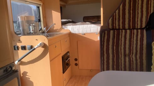 Semi-integrated camper