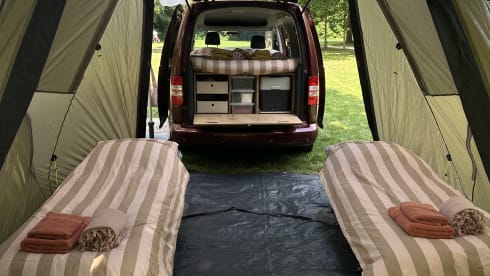 Super nice Volkswagen Caddy Maxi campervan from 2011 with tent, 4p
