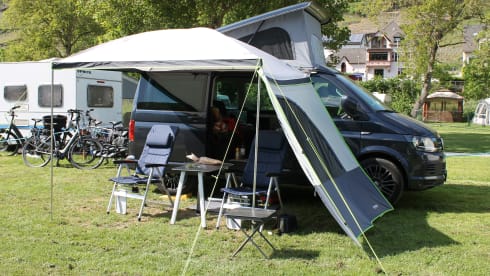 nice VW T6 Multivan with wide bed, pop-up roof, automatic