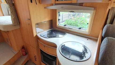 Comfortable camper with single beds and air conditioning