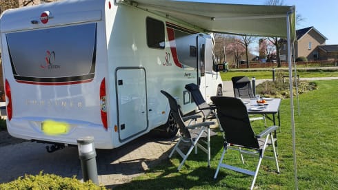 luxury camper including queen-size bed, pull-down bed and large garage and tow bar