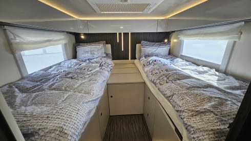 Luxury 4-person motorhome with bicycle rack and tow bar, model 2026