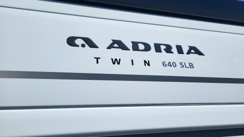 Adria Twin Sport 640 SLB wit – Chic camper van automatic with single beds, navigation system, etc.