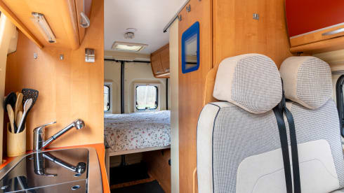 2 person bus camper with fixed bed and sanitary facilities