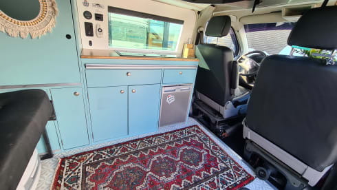 cool and cozy off grid camper van with lifting roof.