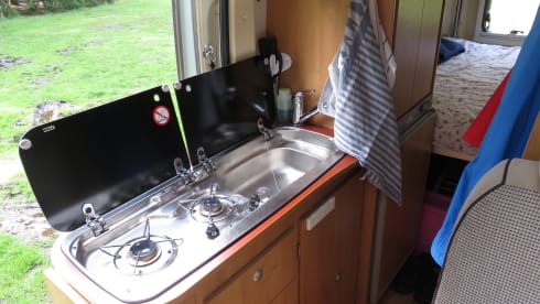 2 person bus camper with fixed bed and sanitary facilities