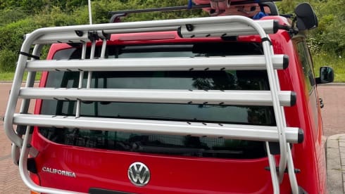 Red Volkswagen bus California T5