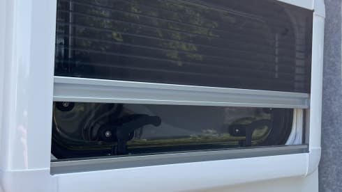 Trendy 2-person camper with solar panels