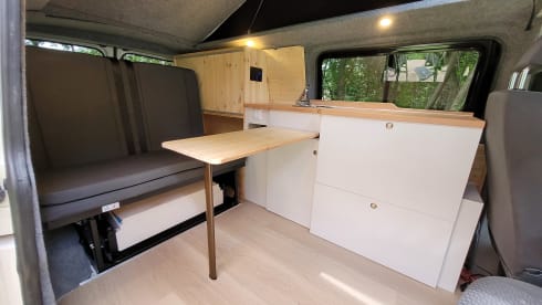 4-person Volkswagen with pop-up roof and long wheelbase for extra space