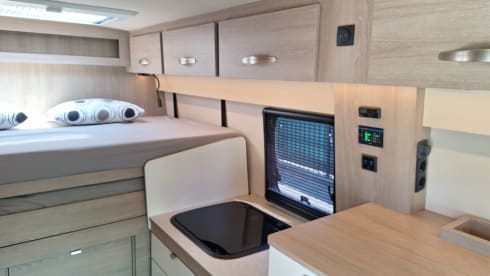 Spazio 4 – AmorA-Camper mit Fahrradgarage und Längsbett 180x200cm