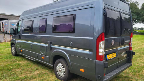 Neat camper van with length beds and solar panels