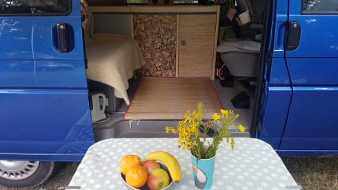 Cheerful Volkswagen camper van with lifting deck and pull-out bed for 2 people