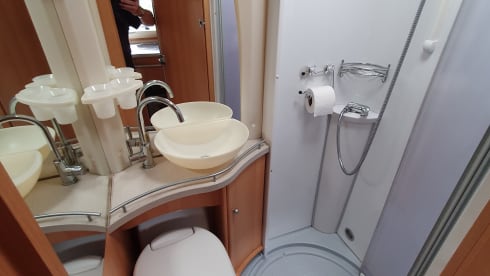 Comfortable camper with single beds and air conditioning