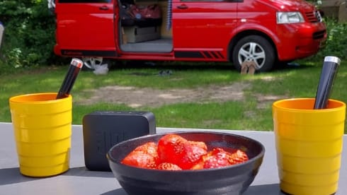Red Volkswagen bus California T5