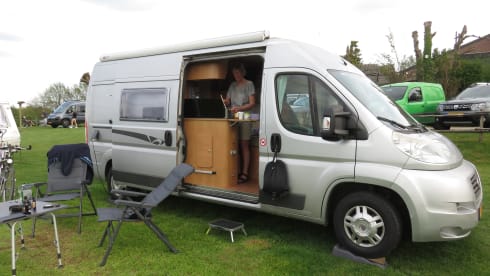 2 person bus camper with fixed bed and sanitary facilities