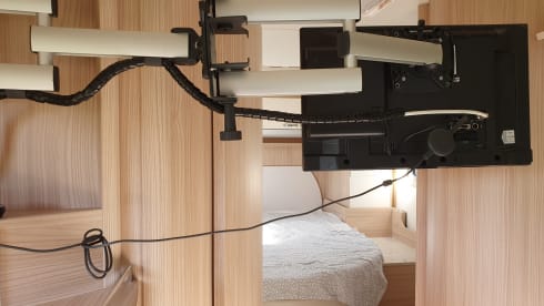 luxury camper including queen-size bed, pull-down bed and large garage and tow bar