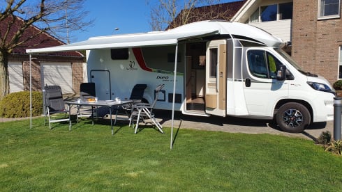 luxury camper including queen-size bed, pull-down bed and large garage and tow bar