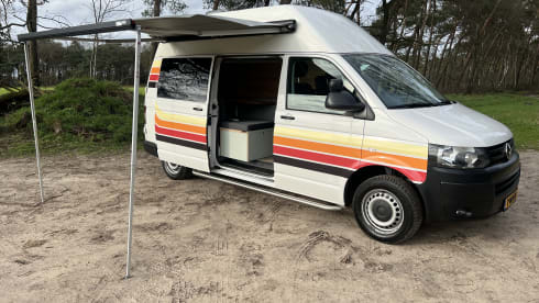 Retro Volkswagen Bus with bicycle carrier & awning