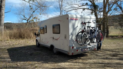 Comfortable motorhome with queen bed and electric bicycle carrier 