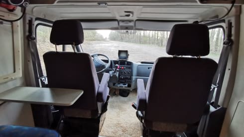 On an adventure with a reliable bus camper.