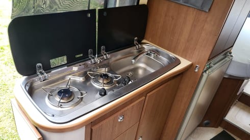 Neat camper van with length beds and solar panels