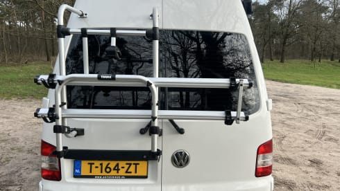 Retro Volkswagen Bus with bicycle carrier & awning