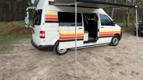 Retro Volkswagen Bus with bicycle carrier & awning
