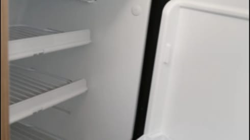 Bus camper with awning, private shower and toilet.