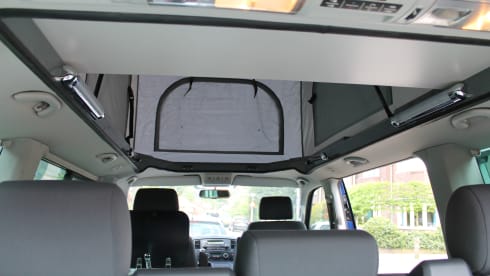 powerful VW T5 Multivan camper van with spacious Reimo pop-up roof