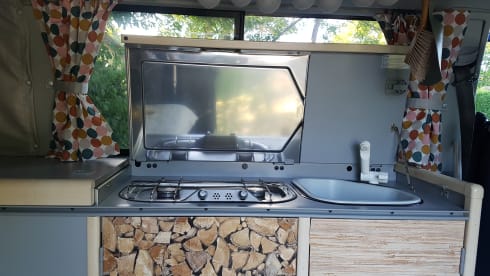Cheerful Volkswagen camper van with lifting deck and pull-out bed for 2 people
