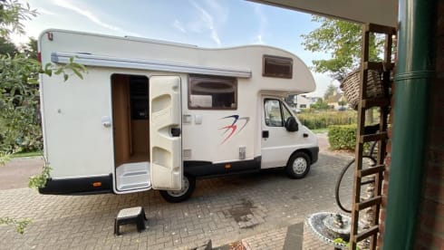 Spacious Fiat 2006 with a fixed bed, air conditioning and a very cozy interior.