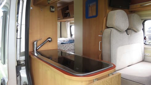 2 person bus camper with fixed bed and sanitary facilities
