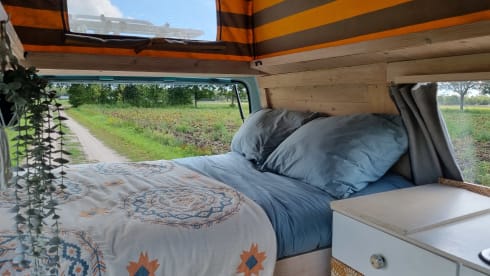 Retro turquoise camper, ready for a road trip. 