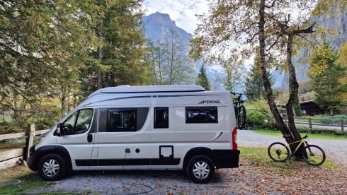 Fijnja – Luxury 4 pers. Pössl bus camper with sleeping lifting roof from 2019