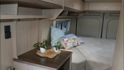 Bus camper with awning, private shower and toilet.