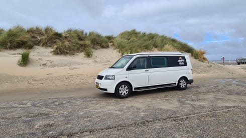 cool and cozy off grid camper van with lifting roof.