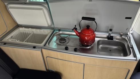 Red Volkswagen bus California T5